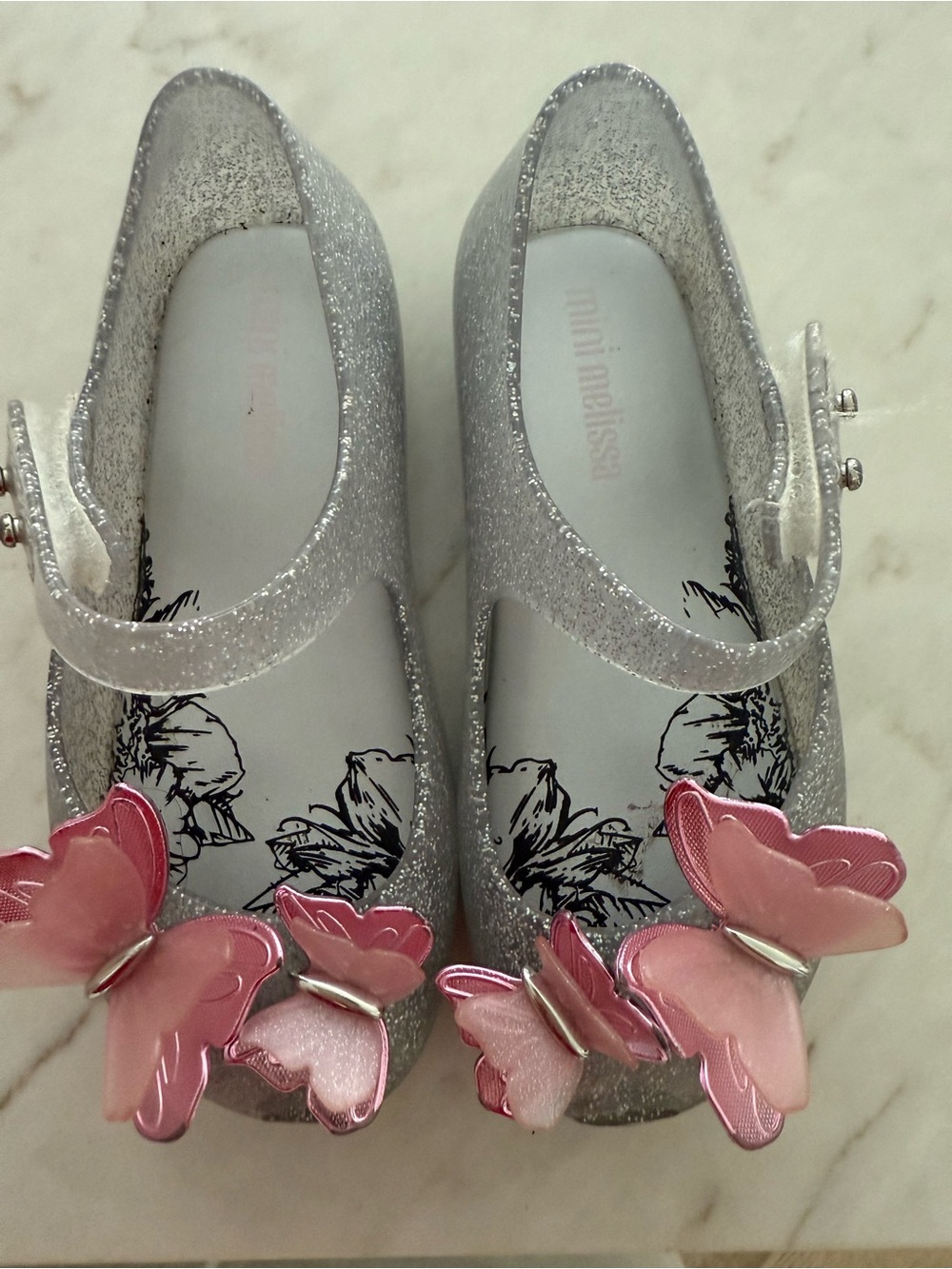 Mini Melissa Silver Glitter Mary Janes with Pink Butterfly Accents